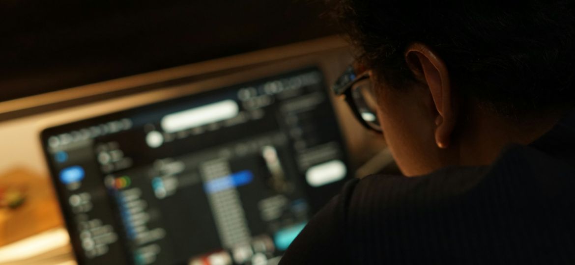 a man looking at a computer screen